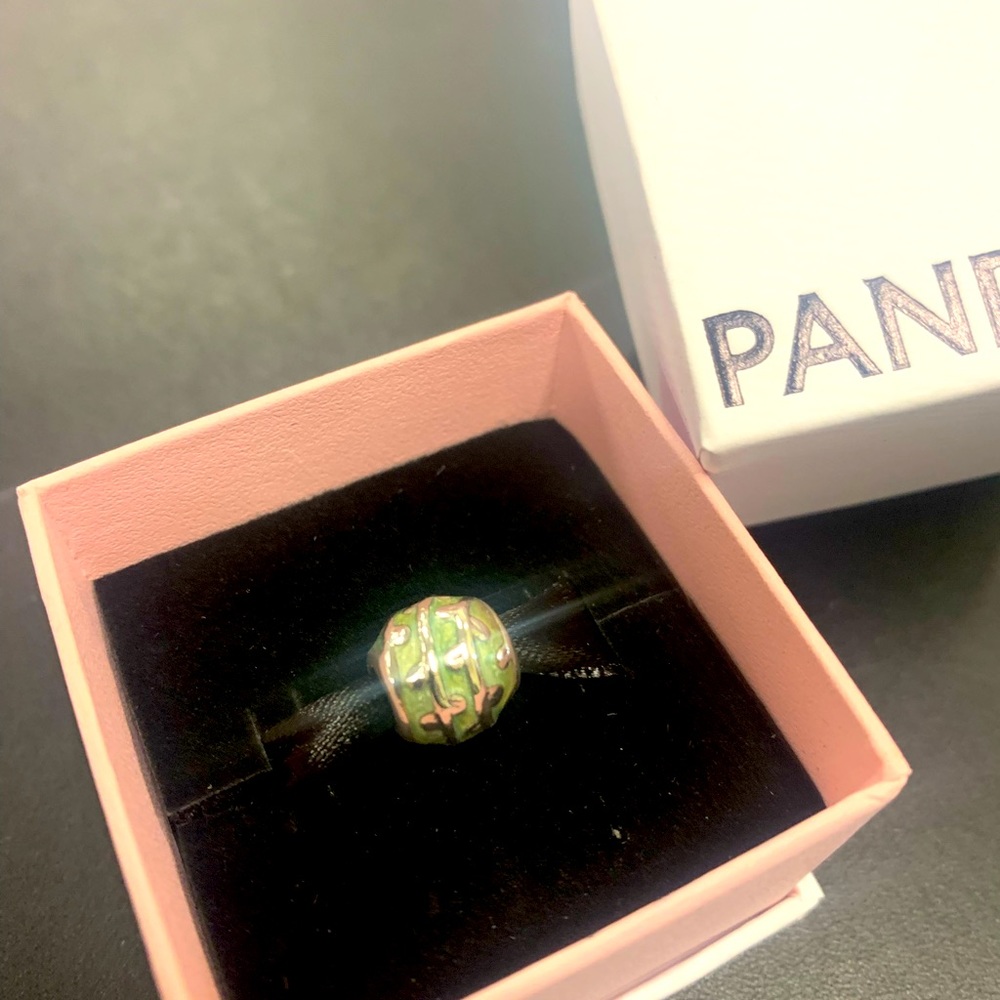 Pandora charm in box gently worn. Shiny blue and sterling